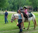 girl riding pony with Laura